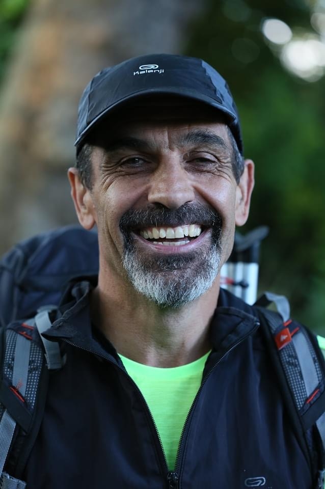 Neil Danby smiling outdoors