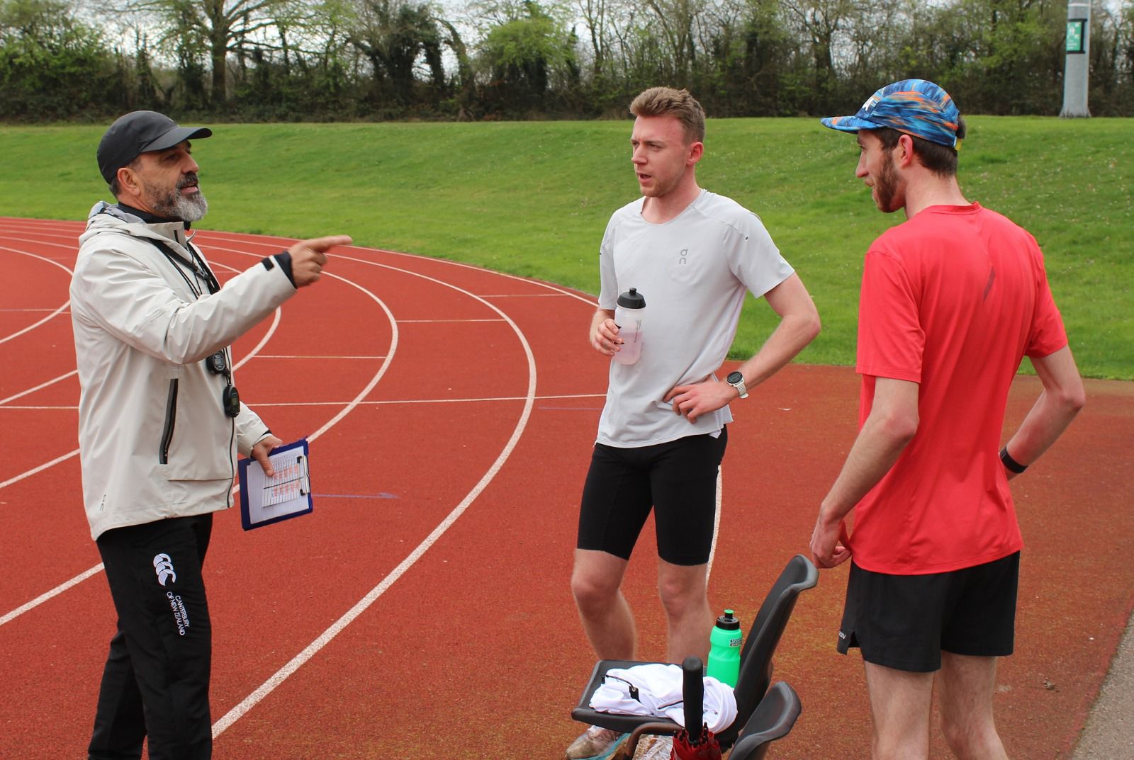 Neil discussing a track session with Jack and Andy